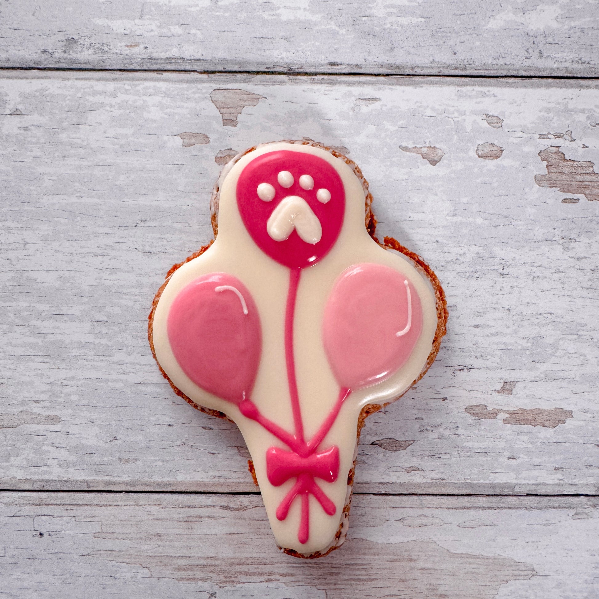 Hand baked dog birthday treats decorated with dog friendly icing.