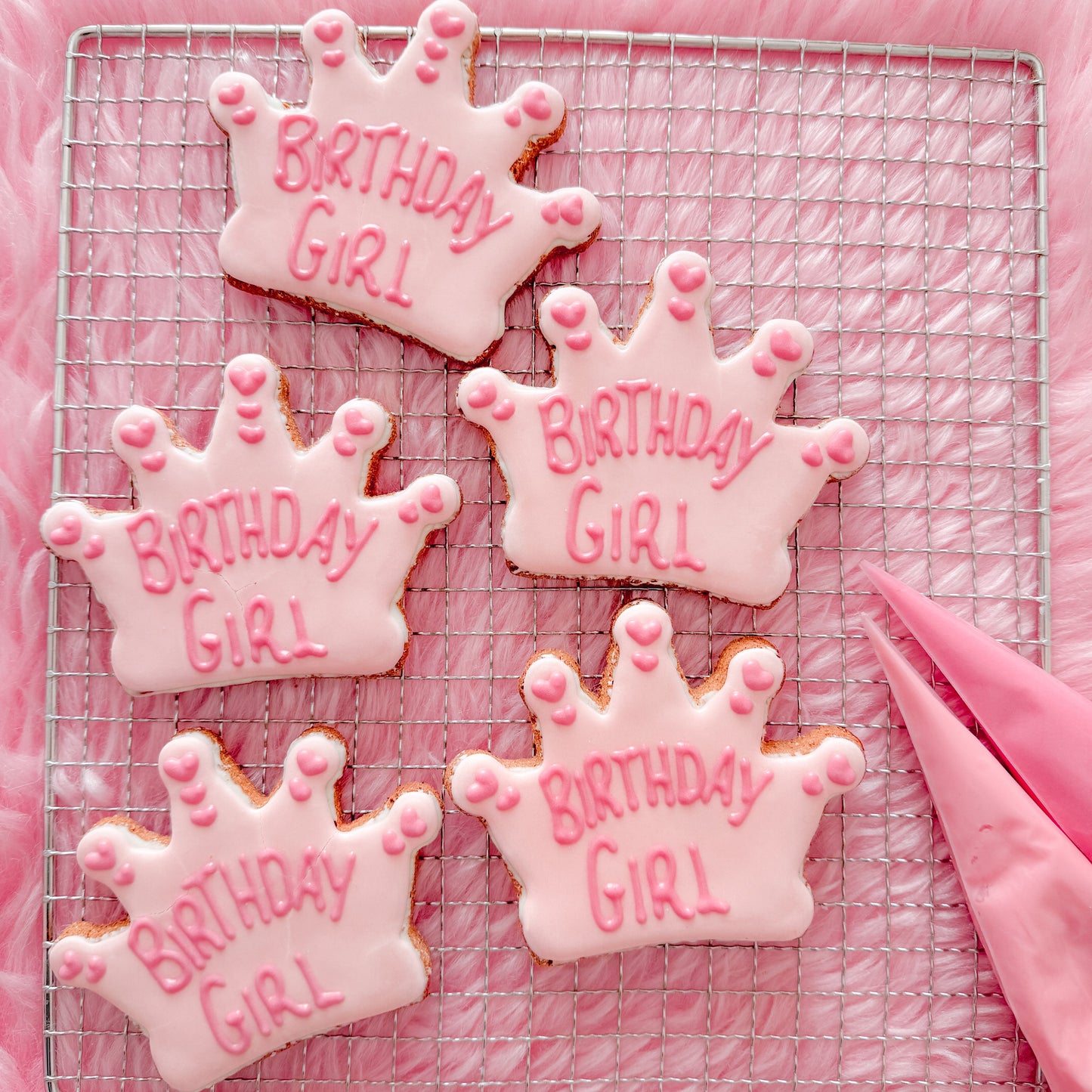  Hand baked dog birthday treats decorated with dog friendly icing.
